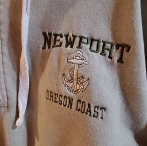 Pale green sweatshirt with hood and partial zip.